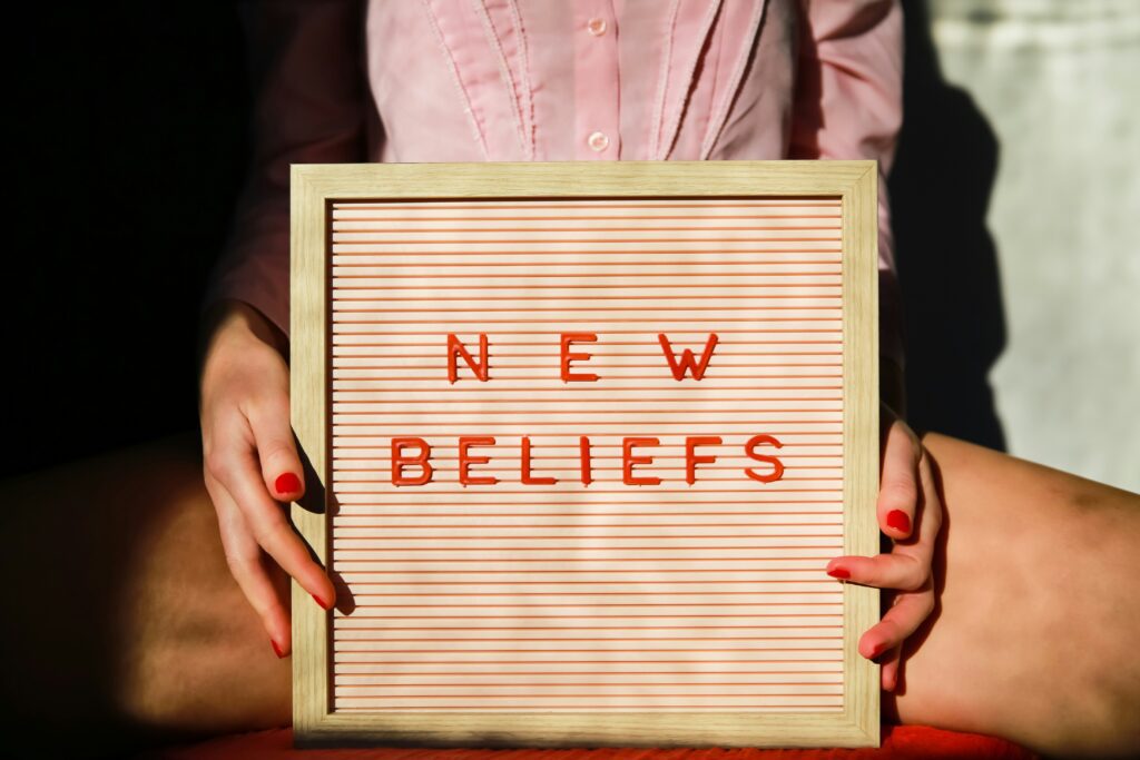 Sign saying "New Beliefs," inviting people to explore progressive Christianity